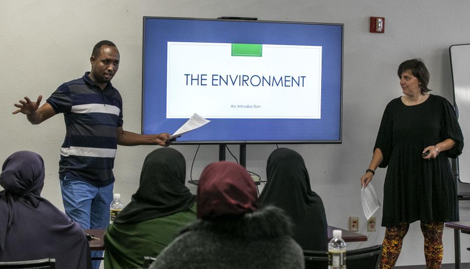 Said Hassan, left, interprets child care instructions from Family and Child Care Resources of Northeast Wisconsin's Jamie Tramte Brassfield, right, during a class for Somali refugee and immigrants.