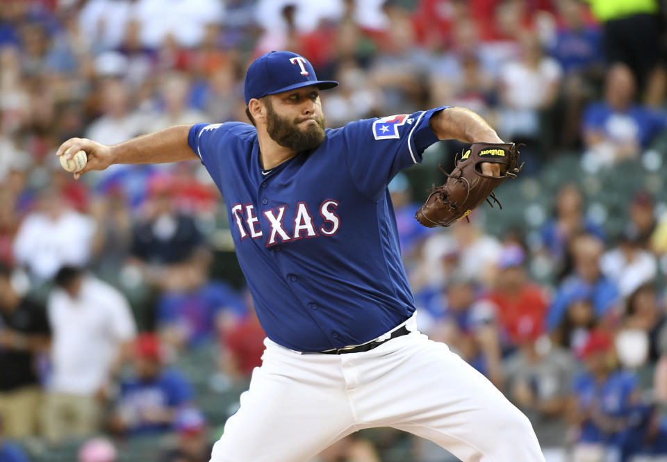 Texas Rangers starting pitcher Lance Lynn works against the Houston Astros during the first inning of a baseball game Thursday, July 11, 2019, in Arlington, Texas. (AP Photo/Jeffrey McWhorter)