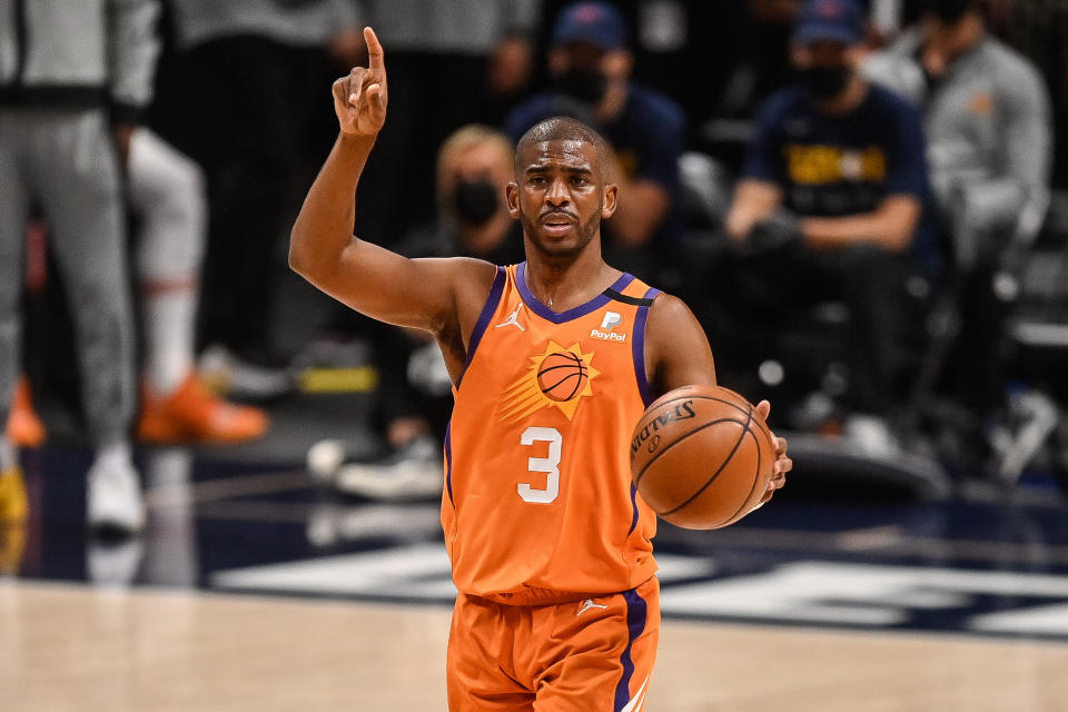 Chris Paul #3 of the Phoenix Suns directs the offense in the first half in Game Three of the Western Conference second-round playoff series at Ball Arena on June 11, 2021 in Denver, Colorado. NOTE TO USER: User expressly acknowledges and agrees that, by downloading and or using this photograph, User is consenting to the terms and conditions of the Getty Images License Agreement. (Photo by Dustin Bradford/Getty Images)