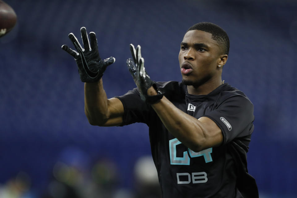 FILE - In this March 1, 2020, file photo, Ohio State defensive back Jeff Okudah runs a drill at the NFL football scouting combine in Indianapolis. Okudah is a likely first-round pick in the NFL draft Thursday, April 23, 2020. (AP Photo/Charlie Neibergall, File)