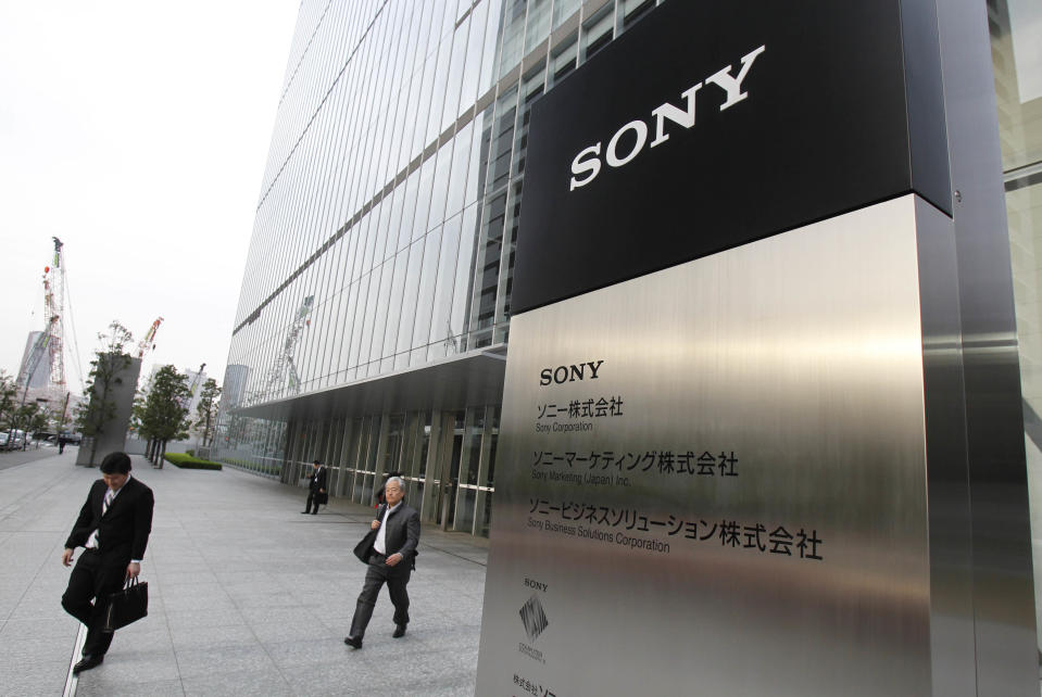 Office workers leave the headquarters of Sony Corp. in Tokyo Tuesday, April 10, 2012. Sony more than doubled Tuesday its projected annual loss to 520 billion yen ($6.4 billion), its worst red ink ever, due to a massive tax charge. (AP Photo/Koji Sasahara)