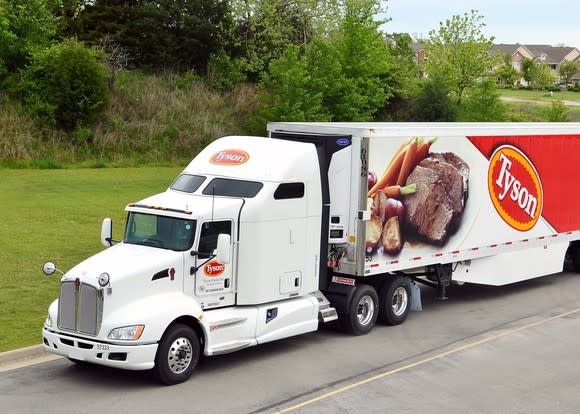 Tyson Foods semi truck with logo and beef dinner product on the side of the tractor trailer