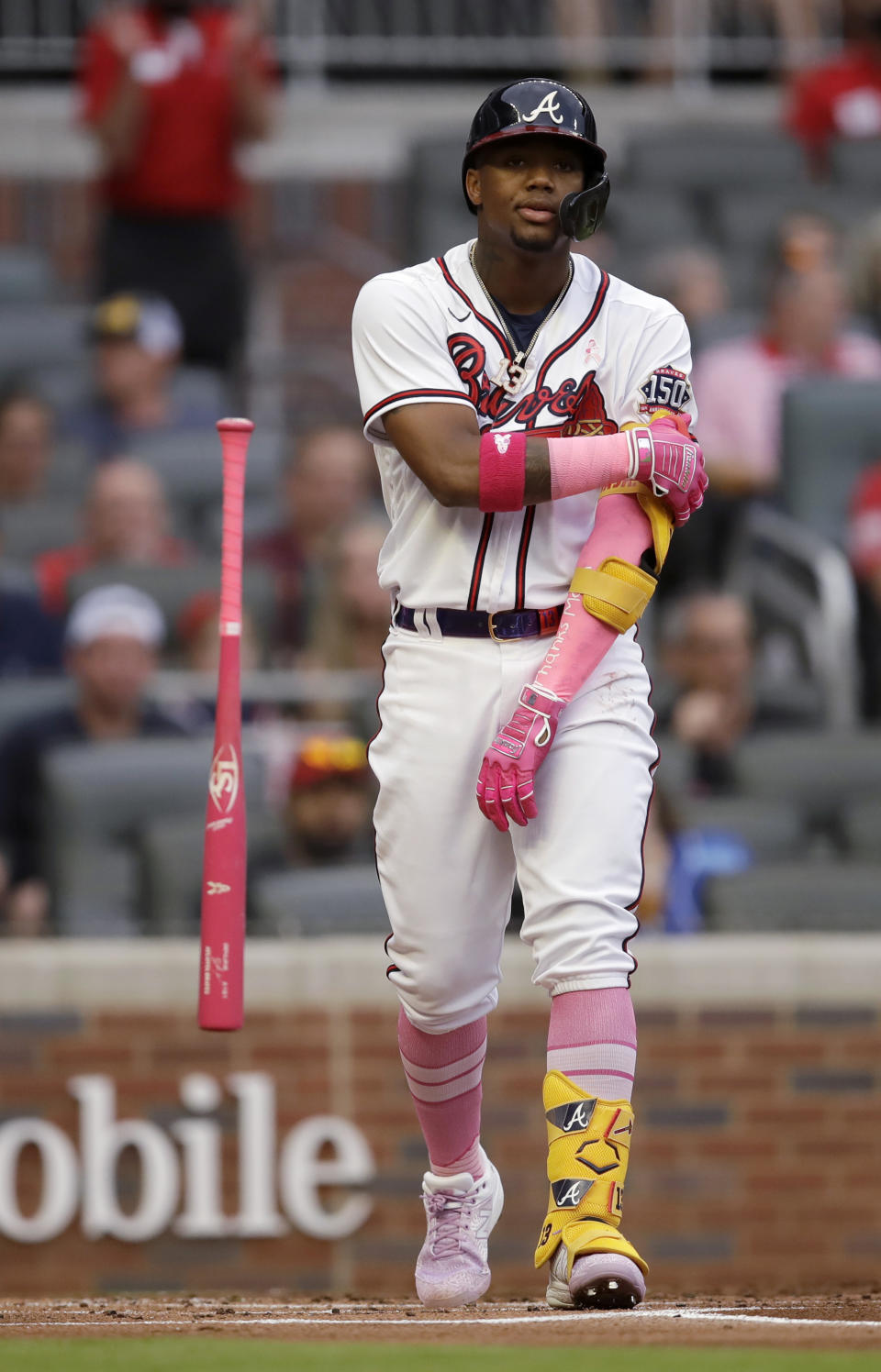 Atlanta Braves' Ronald Acuna Jr. flips his bat after walking on pitches from Philadelphia Phillies' Aaron Nola during the first inning of a baseball game Sunday, May 9, 2021, in Atlanta. (AP Photo/Ben Margot)