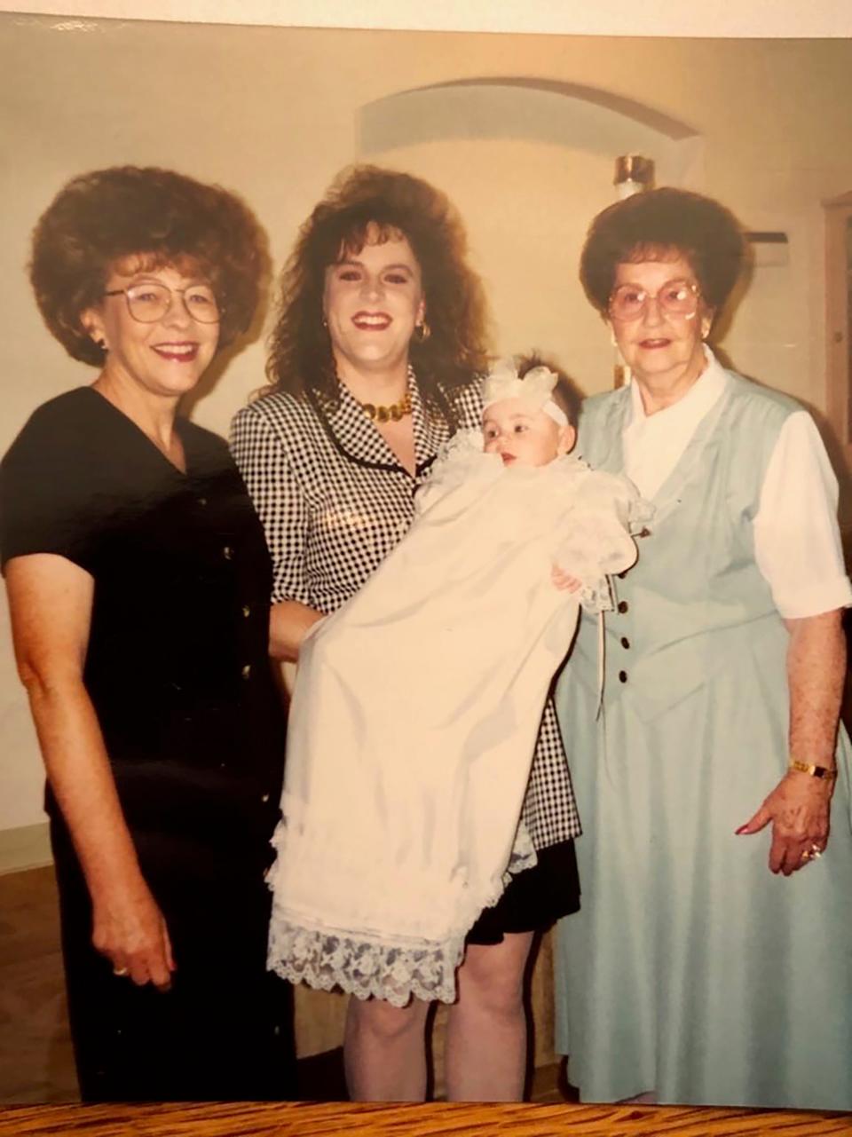 Lorene Porter (right) smiles for a photo with her daughter (left) her granddaughter (middle) and her first great-grandchild in 1996.