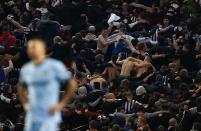 Newcastle United fans celebrate their team's second goal against Manchester City during their English League Cup fourth round soccer match at the Etihad Stadium in Manchester, northern England in this October 29, 2014 file photo. REUTERS/Darren Staples/Files (BRITAIN - Tags: SPORT SOCCER TPX IMAGES OF THE DAY)