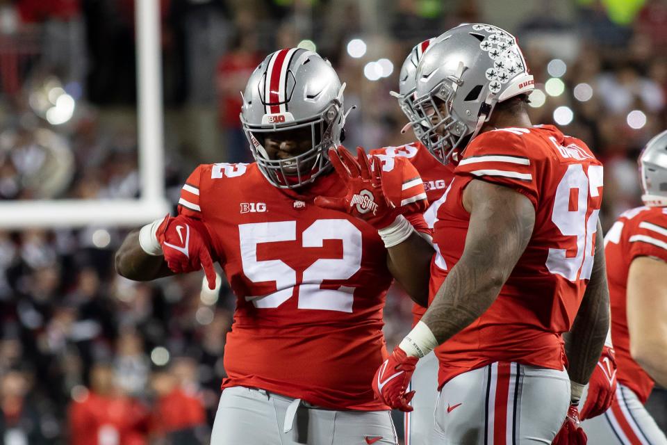 Ohio State Buckeyes defensive tackle Antwuan Jackson (52) celebrates a sack on Akron Zips quarterback DJ Irons (0) during the game against the Akron Zips at Ohio Stadium in Columbus, Ohio Sept. 25. Ohio State would win the game 59-7