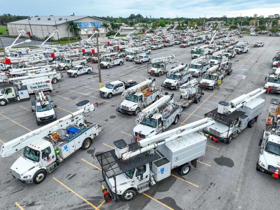 Ahead of Hurrican Ian’s expected time to make landfall Florida Power and Light crews assemble in the parking lot of the Sarasota Fair Grounds on Tuesday. 09/27/2022