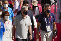 President of the International Olympic Committee, Thomas Bach, left, walks with former Olympic champion Sebastian Coe at the women's marathon at the 2020 Summer Olympics, Saturday, Aug. 7, 2021, in Sapporo, Japan. (AP Photo/Shuji Kajiyama)