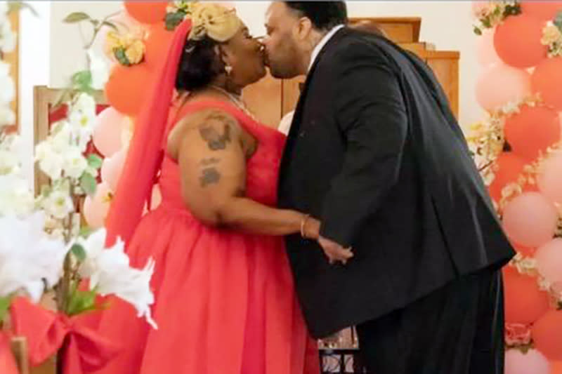 Toraze and Johnnie Mae Davis kiss at their wedding ceremony. (Courtesy Monica Miller)