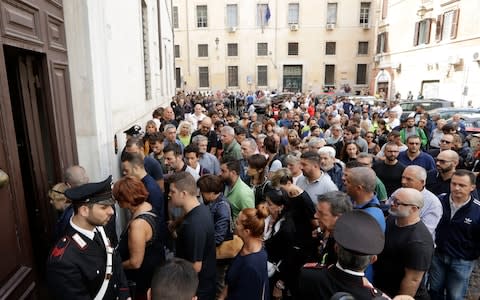 People arrive to pay respect in the church where Carabinieri officer Mario Cerciello Rega was laid in state, in Rome, Sunday, July 28, 2019. - Credit: AP