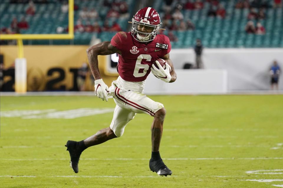 FILE - In this Monday, Jan. 11, 2021 file photo, Alabama wide receiver DeVonta Smith runs for a touchdown against Ohio State during the first half of an NCAA College Football Playoff national championship game in Miami Gardens, Fla. The New York Giants spent the two months leading up to the draft in a somewhat unexpected dip into the free agency market that filled holes at wide receiver and cornerback, and narrowed their positional needs.(AP Photo/Chris O'Meara, File)