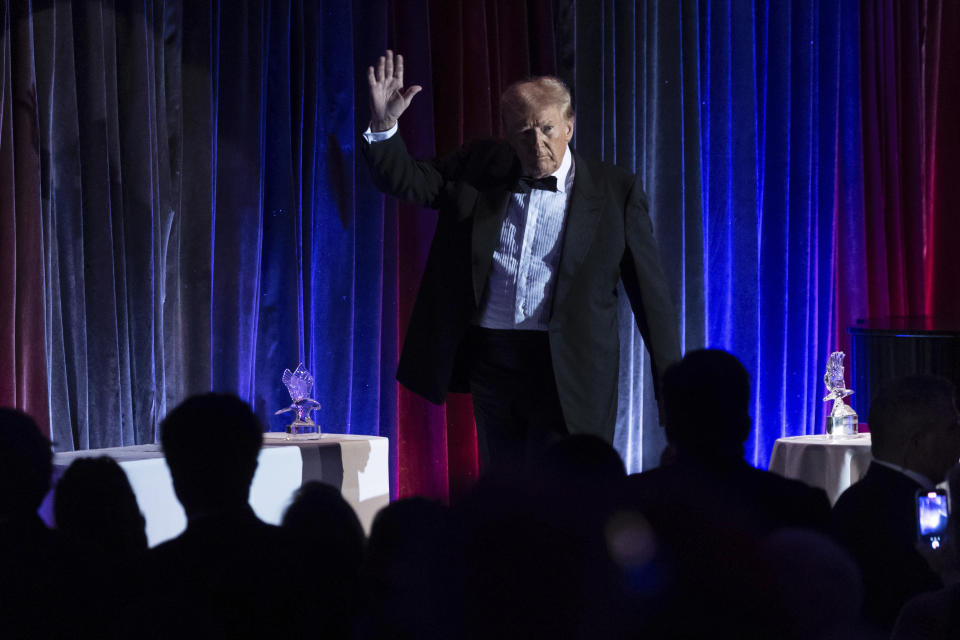 Former President Donald Trump exits the stage during the New York Young Republican Club's annual gala at Cipriani Wall Street, Saturday, Dec. 9, 2023. (AP Photo/Yuki Iwamura)