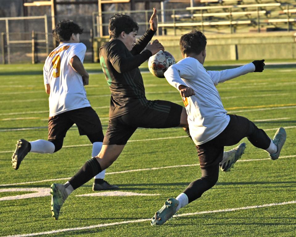 Bossier's Felix Deras fights to move the ball against Tara in their playoff game Thursday.