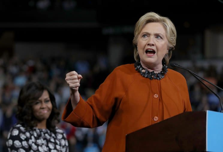 WINSTON-SALEM, NC - OCTOBER 27: Democratic presidential nominee former Secretary of State Hillary Clinton (R) speaks as First Lady Michelle Obama looks on during a campaign rally at Wake Forest University on October 27, 2016 in Winston-Salem, North Carolina. (Photo by Justin Sullivan/Getty Images)