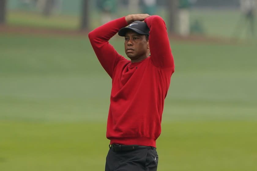 Tiger Woods reacts after a near chip in on the second hole during the final round of the Masters.