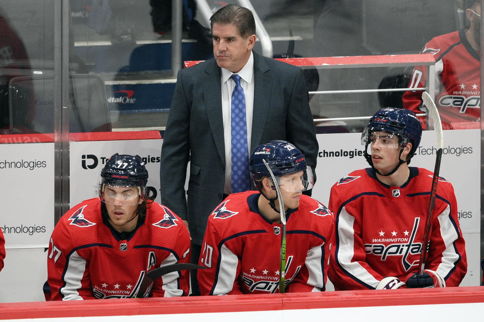 FILE - Washington Capitals head coach Peter Laviolette looks on during the second period of an NHL preseason hockey game against the Philadelphia Flyers, Friday, Oct. 8, 2021, in Washington. The New York Rangers have hired Laviolette as their next coach, bringing in a seasoned veteran with Stanley Cup-winning experience to replace Gerard Gallant, the team announced Tuesday, June 13, 2023. (AP Photo/Nick Wass, File)