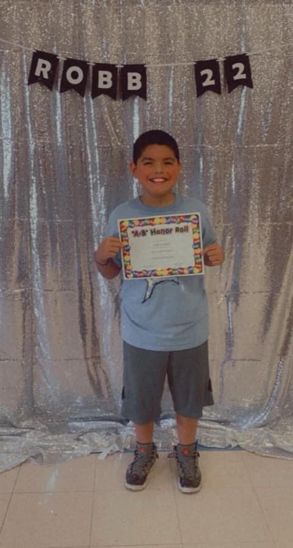 Jose Flores received an award for making the honour roll hours before shooting, his uncle said (Family/Facebook)