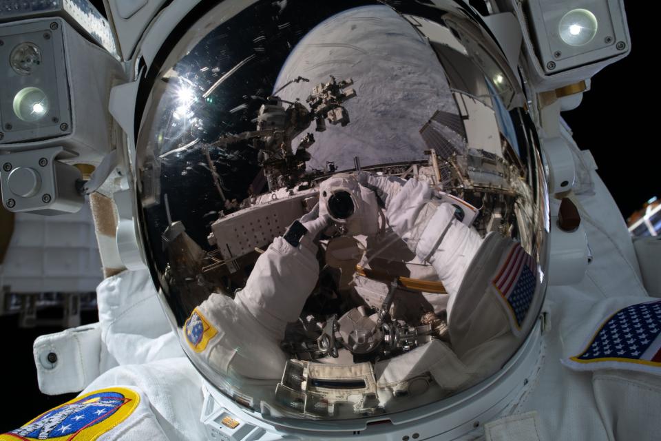 Astronaut Kayla Barron takes a selfie as she performs a spacewalk to repair a damaged antenna in early December.