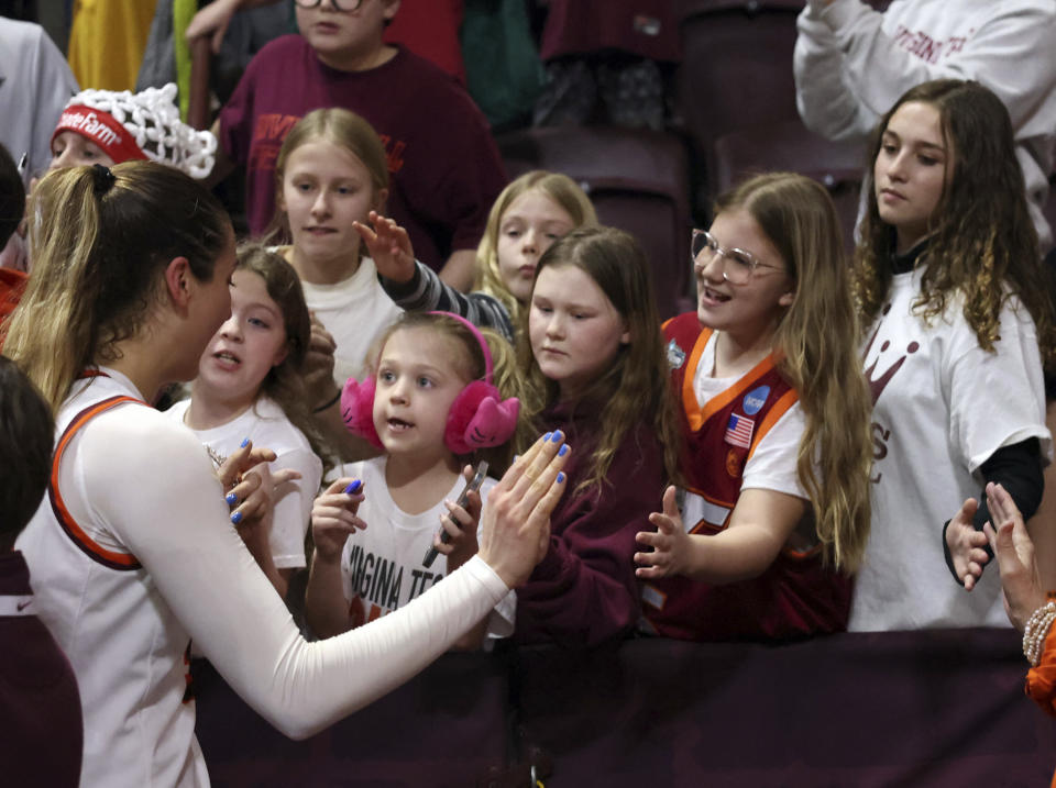 Virginia Tech's Elizabeth Kitley (33) meets with fans after an NCAA college basketball game against North Carolina in Blacksburg Va. Sunday, Feb. 25, 2024. (Matt Gentry/The Roanoke Times via AP)