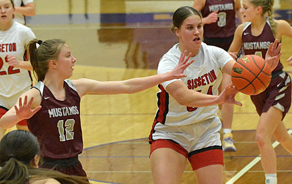 Sisseton's Krista Langager passes the ball against Tri-Valley's Madelyn Wenzel during their Class A SoDak 16 girls basketball game on Thursday, Feb. 29, 2024 in the Watertown Civic Arena. Sisseton won 63-52.