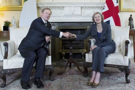 Britain's Prime Minister Theresa May (R) poses for photographers with Ireland's Taoiseach Enda Kenny inside 10 Downing Street, London, Britain July 26, 2016. REUTERS/Stefan Rousseau/Pool