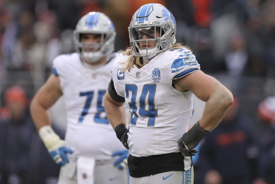 FILE - Detroit Lions linebacker Alex Anzalone (34) looks on during an NFL football game, Sunday, Dec. 10, 2023, in Chicago. Lions linebacker Alex Anzalone had an issue of his own that he wanted to talk to someone about, trying to get over the trauma triggered by the sound of his son's leg breaking while they went down a slide together. (AP Photo/Melissa Tamez, File)