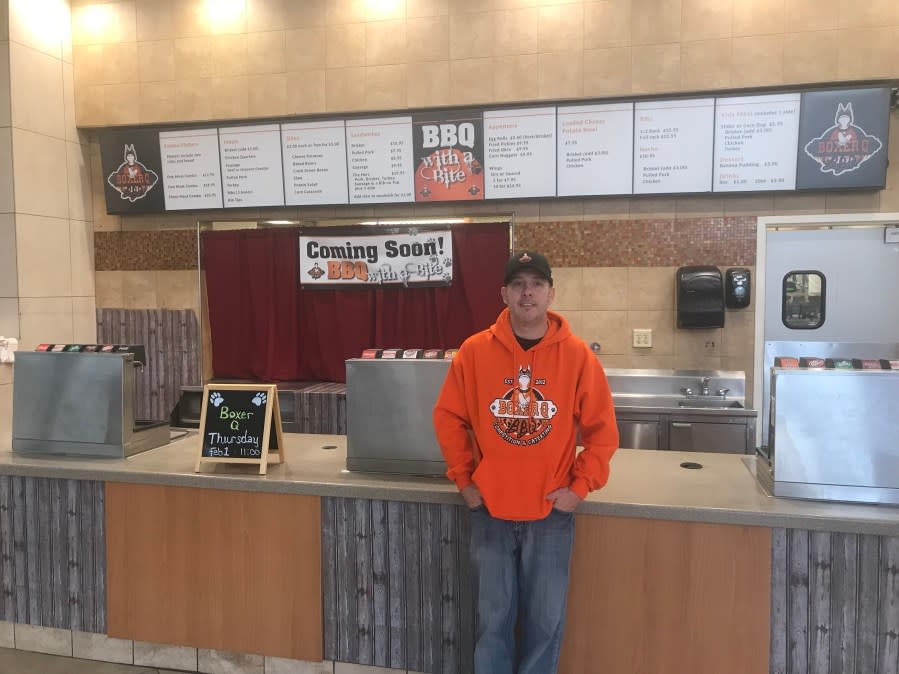 <em>Hank Burch stands in front of his new spot at West Ridge Mall. (Photo Courtesy/Matthew Self)</em>