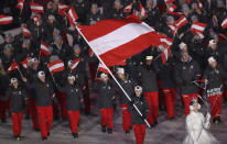 <p>Anna Keith carries the flag of Austria during the opening ceremony of the 2018 Winter Olympics in Pyeongchang, South Korea, Friday, Feb. 9, 2018. (AP Photo/Michael Sohn) </p>