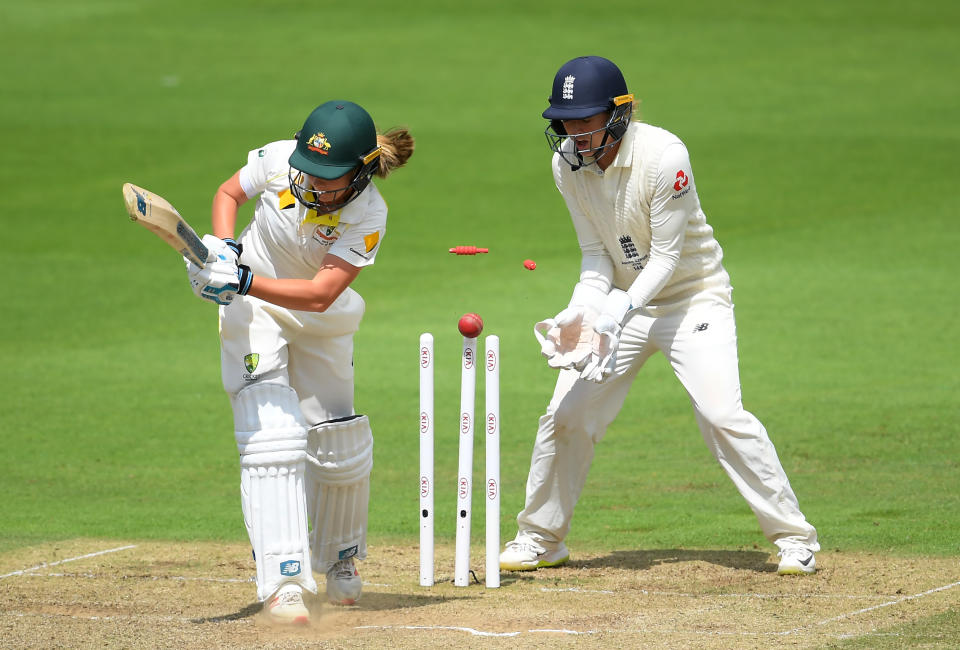 TAUNTON, ENGLAND - JULY 20: Sophie Molineux of Australia  of Australia is bowled by Sophie Ecclestone (not pictured) of England watched on by Sarah Taylor of England during Day Three of the Kia Women's Test Match between England Women and Australia Women at The Cooper Associates County Ground on July 20, 2019 in Taunton, England. (Photo by Alex Davidson/Getty Images)