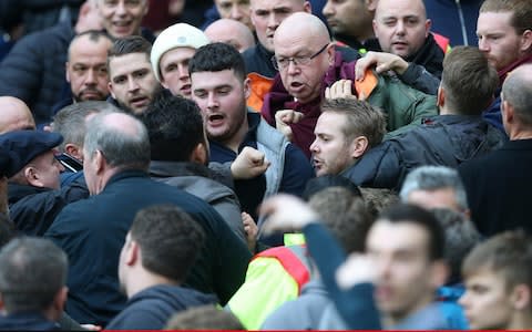 West Ham fans fight amongst themselves during the Premier League match between West Ham United and Burnley at London Stadium on March 10, 2018 - Credit:  Charlotte Wilson/Offside