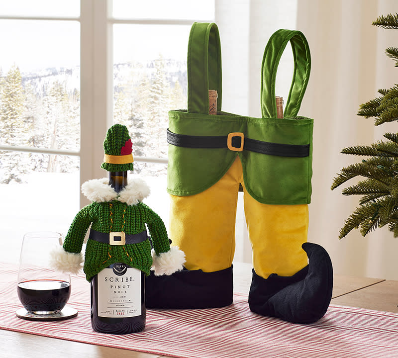 The Elf knit beverage jacket ($24.50) and the Elf double wine bag ($34.50) from the Pottery Barn X "Elf" collection. 