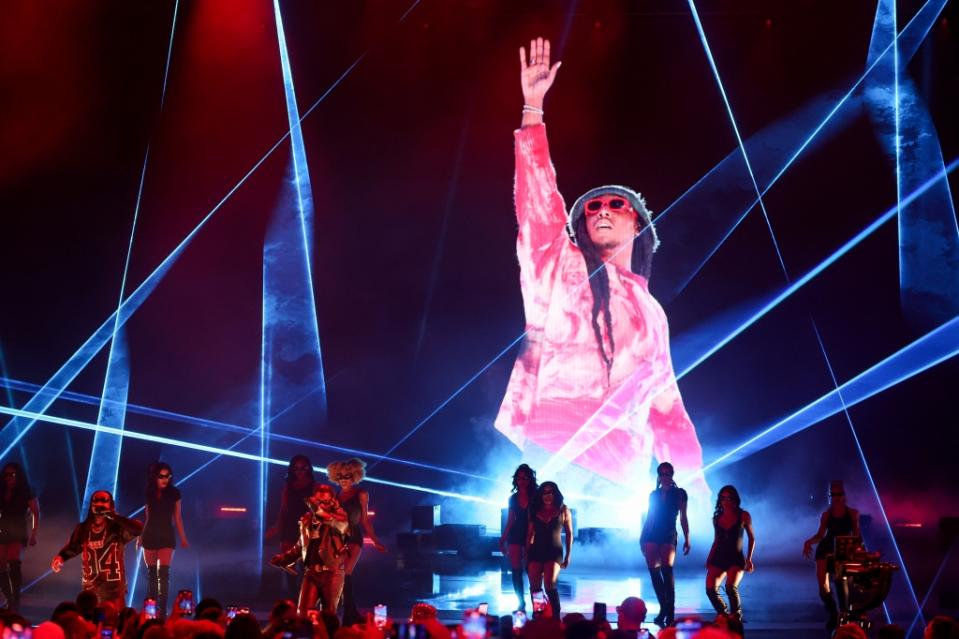 Quavo and Offset of Migos perform in front of a photo of Takeoff at the BET Awards 2023 held at Microsoft Theater on June 25, 2023 in Los Angeles, California.