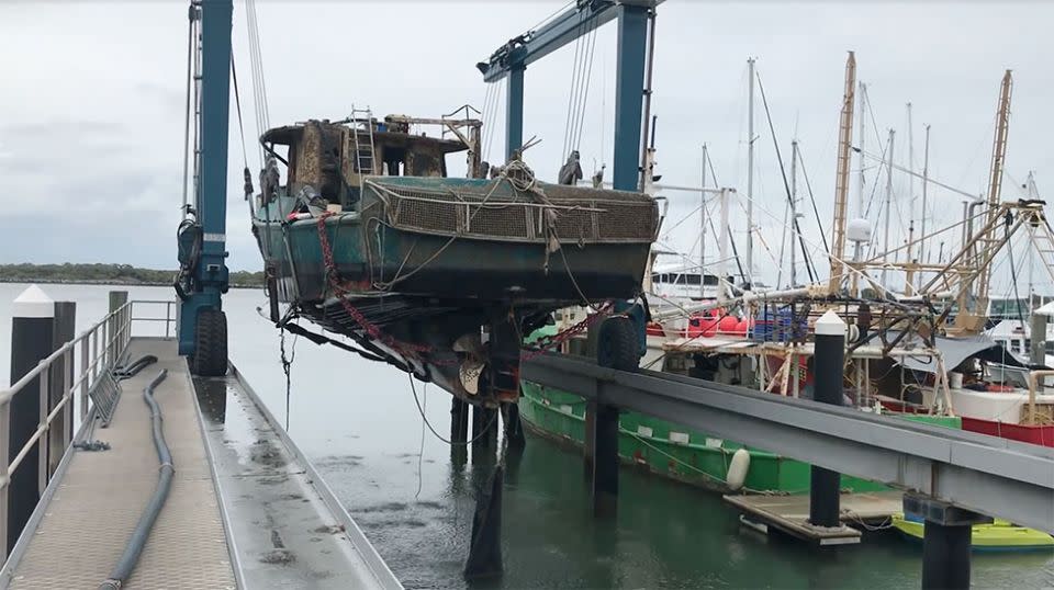 The FV Dianne was lifted out of the water at Bundaberg Port after being towed into port. Source: Queensland Police