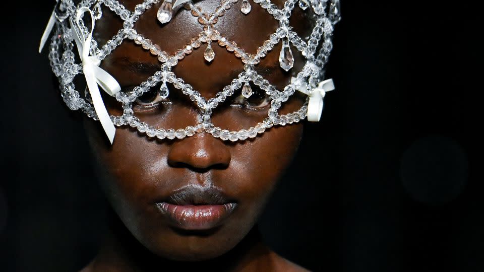 Simone Rocha also included beaded headpieces that extended over the models faces. - Victor Virgile/Gamma-Rapho/Getty Images