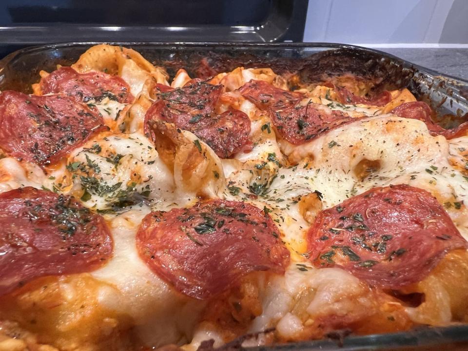A photo of the pizza pasta dish just out of the oven.