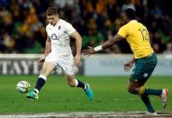 Rugby Union - Rugby Test - England v Australia's Wallabies - Melbourne, Australia - 18/06/16. England's Owen Farrell kicks the ball as Australia's Tevita Kuridrani runs towards him during the second half. REUTERS/Brandon Malone