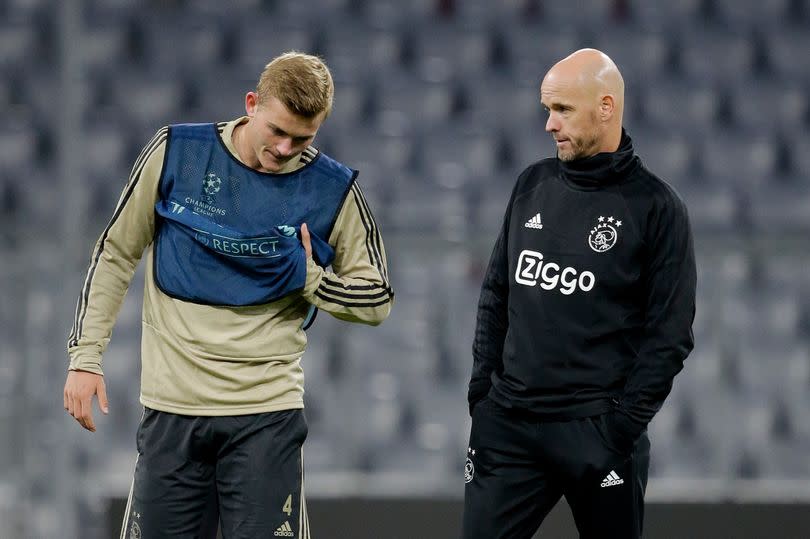 Matthijs de Ligt and Erik ten Hag chat during an Ajax training session in 2018