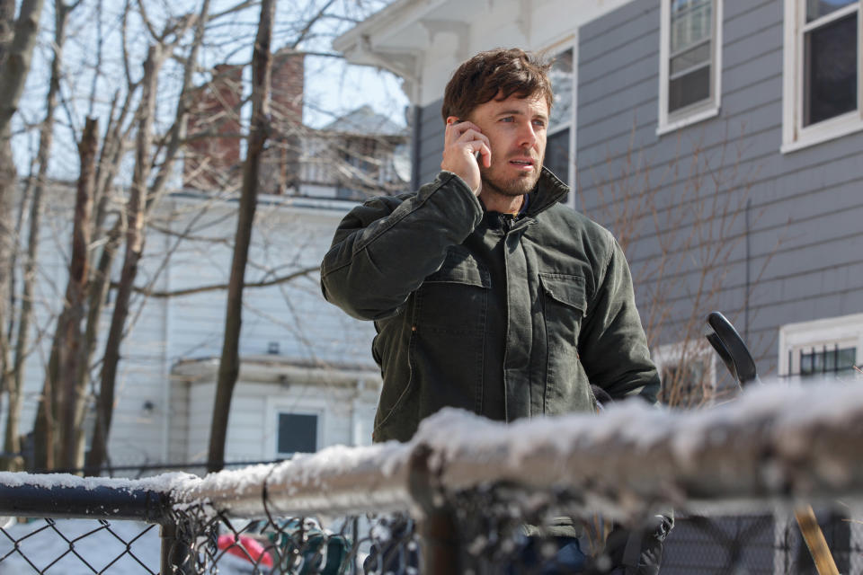 a man talking on the phone outside