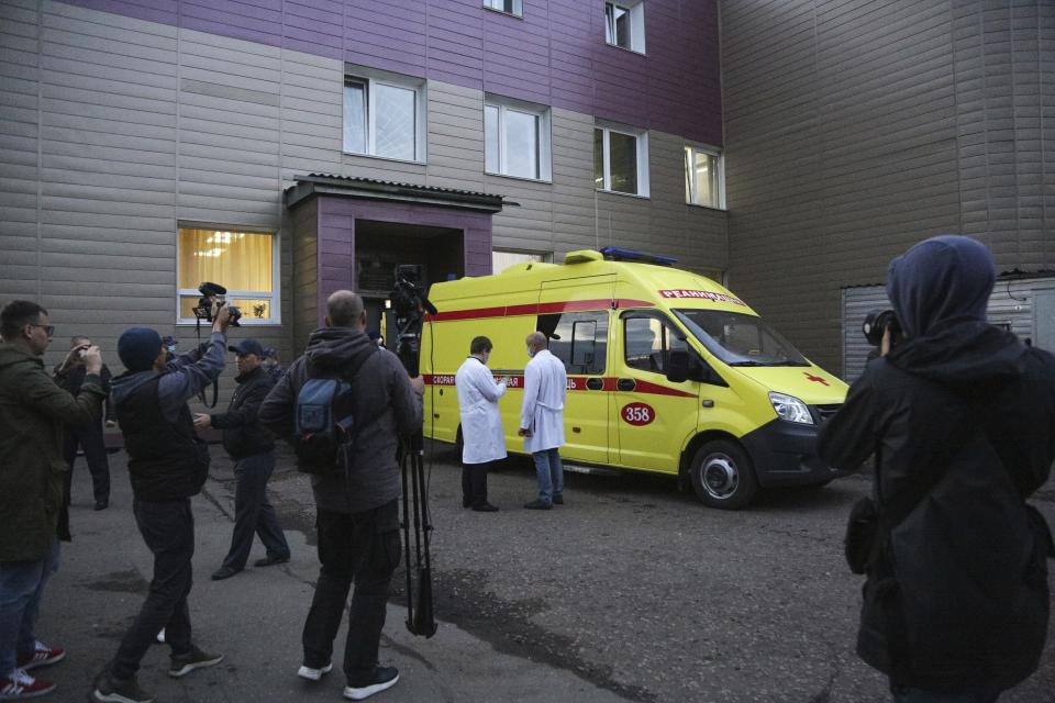 An ambulance is parked at the Omsk Ambulance Hospital No. 1, intensive care unit where Alexei Navalny was hospitalized to pick-up him to the airport in Omsk, Russia, Saturday, Aug. 22, 2020. A dissident who is in a coma after a suspected poisoning has been transferred to an ambulance and is now being driven to an airport in the Siberian city of Omsk. Alexei Navalny will be flown to Germany to receive treatment. (AP Photo/Evgeniy Sofiychuk)
