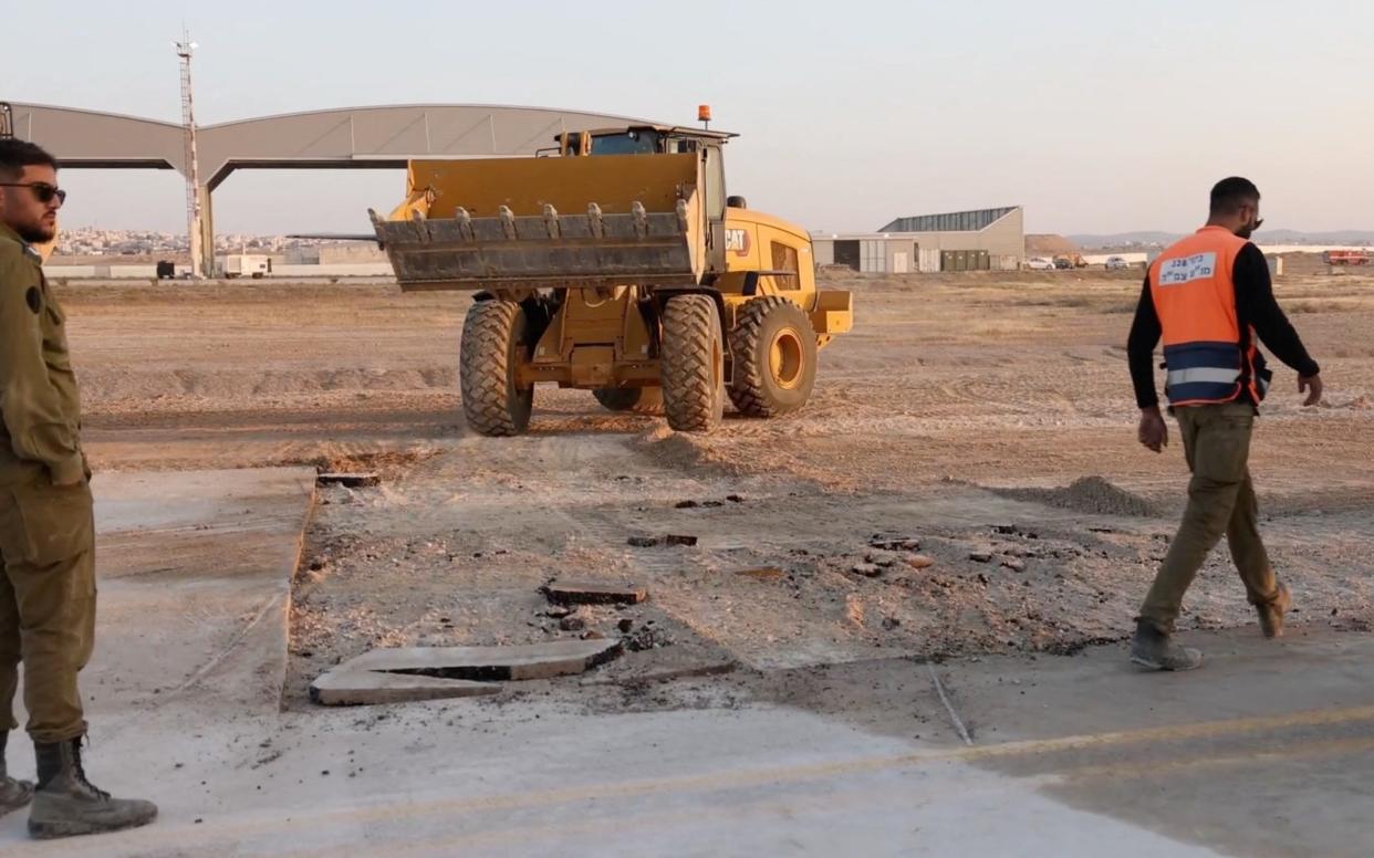 A damaged area at Nevatim airbase in Israel after being hit by ballistic missiles during Iran's attack