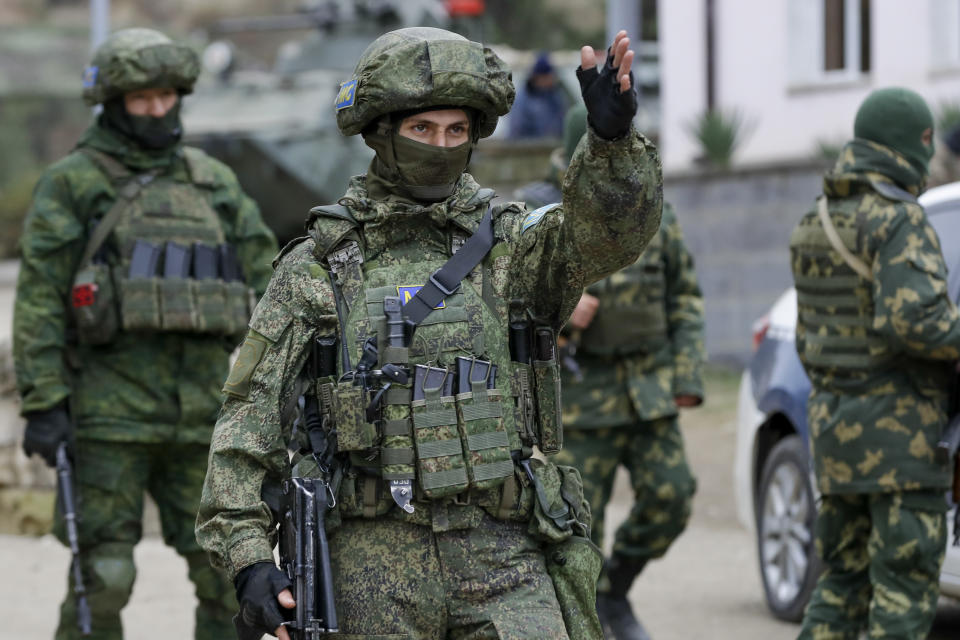 Russian peacekeepers patrol an aria in Stepanakert, the separatist region of Nagorno-Karabakh, on Sunday, Nov. 15, 2020. Ethnic Armenian forces had controlled Nagorno-Karabakh and sizeable adjacent territories since the 1994 end of a separatist war. Fighting resumed in late September and have now ended with an agreement that calls for Azerbaijan to regain control of the outlying territories as well as allowing it to hold on to parts of Nagorno-Karabakh that it seized during the fighting. (AP Photo/Sergei Grits)