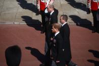 <p>Prince William, Peter Phillips, and Prince Harry walk together in the royal procession. </p>
