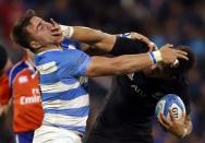 Argentina Rugby Union - Rugby Championship - Argentina v New Zealand All Blacks - Jose Amalfitani stadium, Buenos Aires, Argentina - 01/10/2016. New Zealand's All Blacks Ardie Savea hands off Argentina's Facundo Isa. REUTERS/Marcos Brindicci