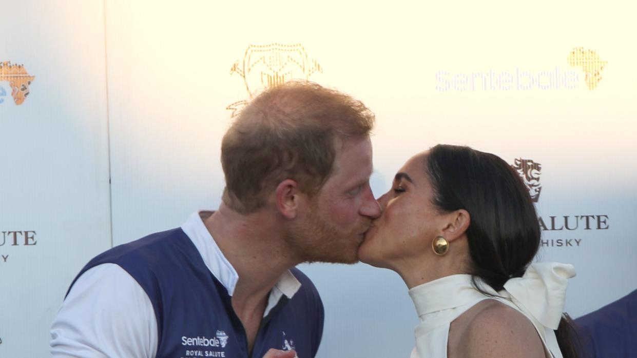 the duchess of sussex presents the trophy to her husband, the duke of sussex after his team the royal salute sentebale team defeated the grand champions team, in the royal salute polo challenge, to benefit sentebale, at the uspa national polo center in wellington, florida, us picture date friday april 12, 2024 photo by yaroslav sabitovpa images via getty images