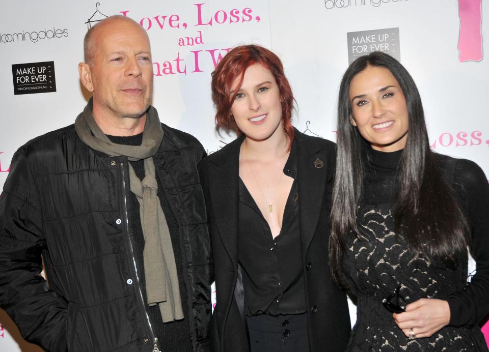 Bruce Willis, Rumer Willis, and Demi Moore standing next to each other