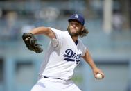 Clayton Kershaw of the Los Angeles Dodgers throws a pitch against the San Diego Padres in the first inning, at Dodger Stadium in Los Angeles, California, on October 4, 2015