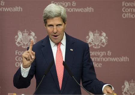 U.S. Secretary of State John Kerry gestures during his joint news conference with Britain's Foreign Secretary William Hague at the Foreign and Commonwealth Office in London September 9, 2013. REUTERS/Alastair Grant/pool