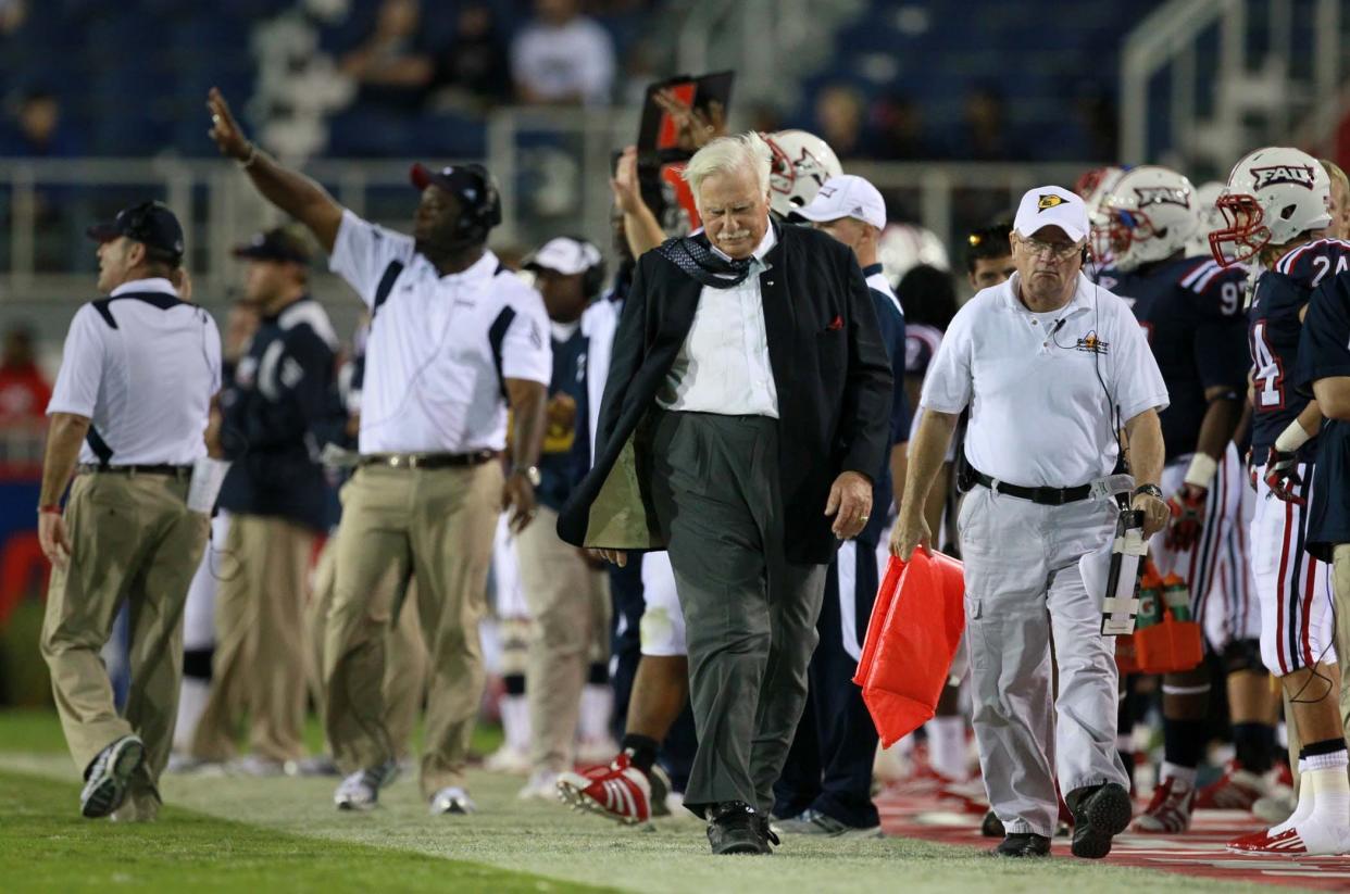Then FAU head coach Howard Schnellenberger walks the sideline during one of the Owls' games in 2003.