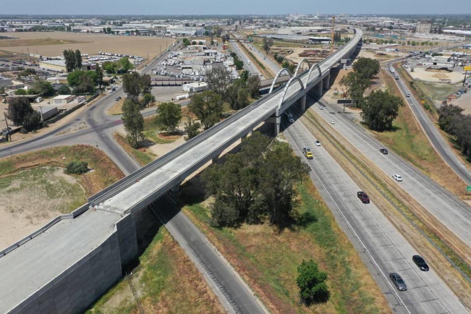 The 3,700-foot-long Cedar Viaduct for California’s high-speed rail project spans above Highway 99 and Cedar Avenue at the south end of Fresno in this photo looking north, taken April 25, 2023. The viaduct will carry high-speed trains on elevated tracks up and over traffic on the street and the highway. Completion of the structure was announced on May 10, 2023.