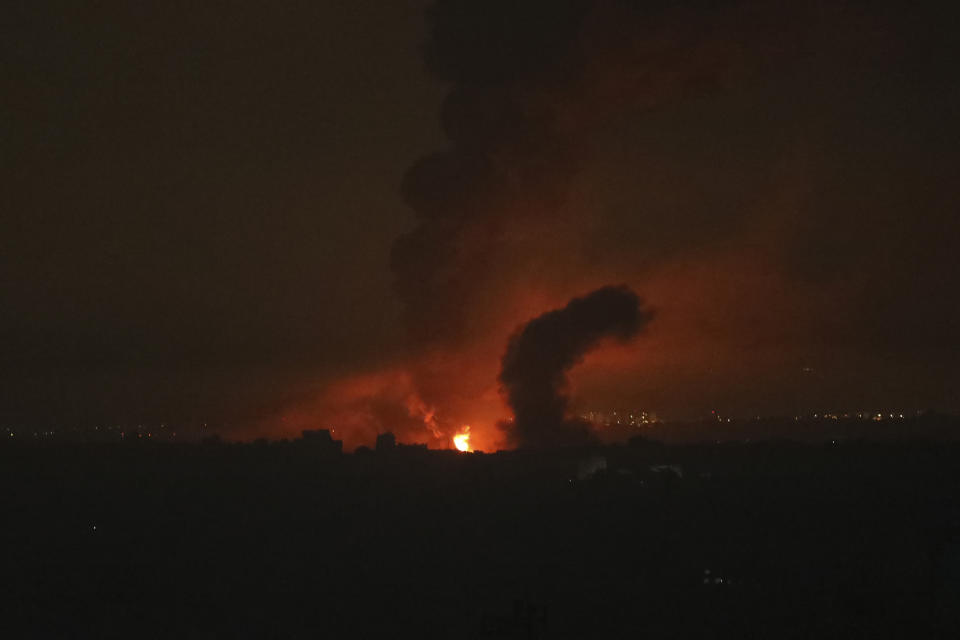 FILE - Fire and smoke rise following Israeli airstrikes in northern Gaza Strip, Nov. 4, 2023. The White House says Israel has agreed to put in place four-hour daily humanitarian pauses in its assault on Hamas in northern Gaza. (AP Photo/Abed Khaled,File)